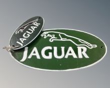 Two cast iron Jaguar wall plaques.