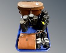 A tray containing three pairs of vintage field glasses including Solus 10x30,