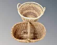 A wicker twin handled log basket and a wicker hand basket