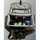 A Canon Eos 10s camera with lens and accessories in camera bag