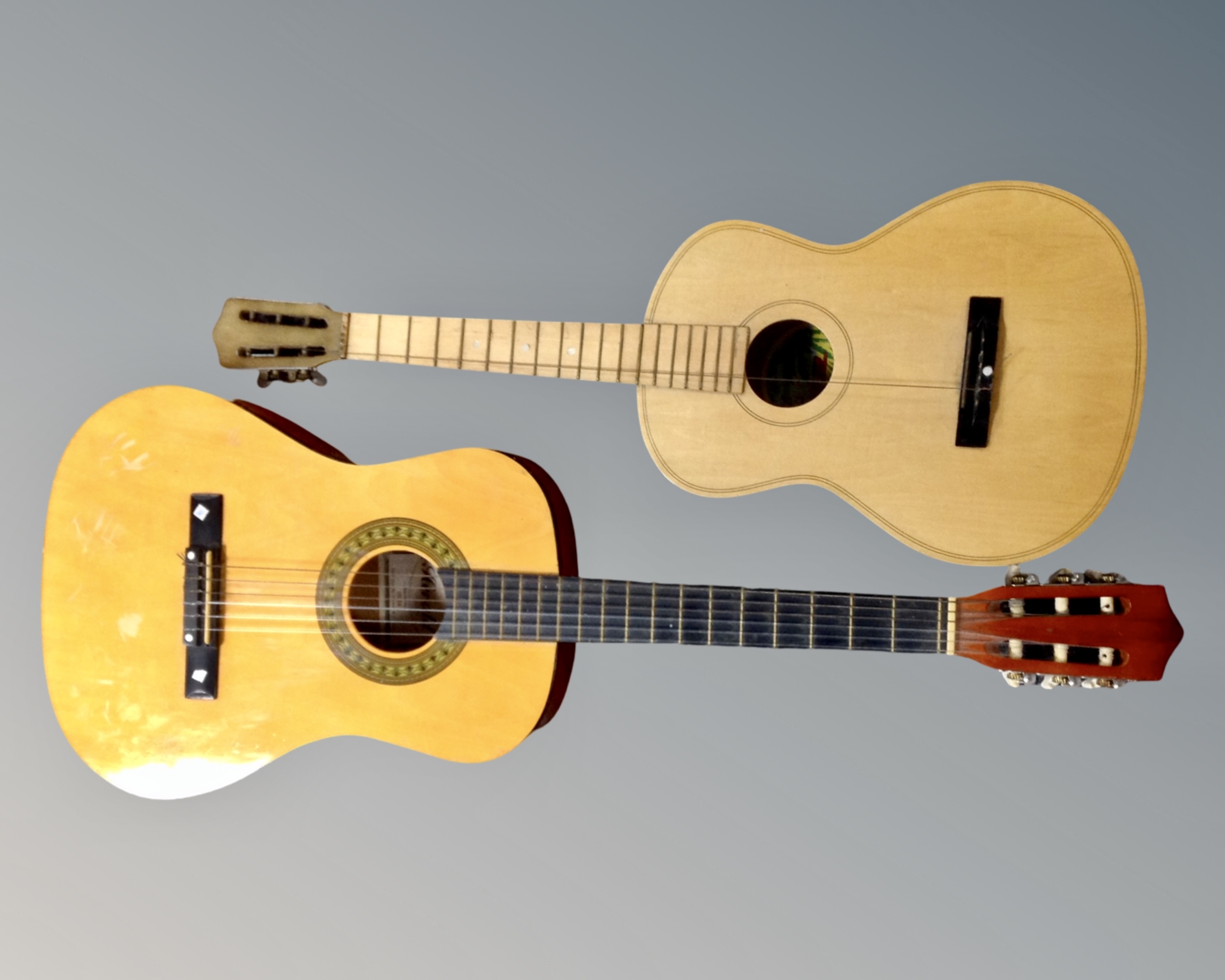 A Herald model number HL34 acoustic guitar and a further Lark Junior guitar