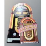 A folding cardboard Wurlitzer advertising sign and folding rock n roll stand