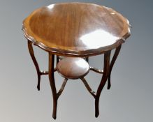 A 19th century shaped inlaid mahogany occasional table
