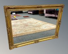 A contemporary gilded mirror,