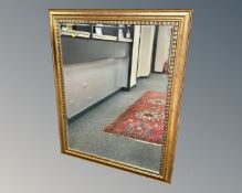 A contemporary gilded mirror,