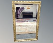 A gilt framed bevelled mirror,