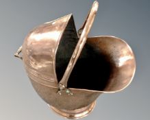 A 19th century copper swing handled coal helmet