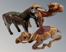 Two miniature leather camels together with a further miniature leather horse