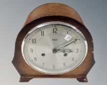 A 1930s oak cased Smiths Enfield mantel clock with silvered dial