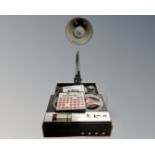 A Philips 4 track reel to reel tape recorder and a grey metal angle poise lamp