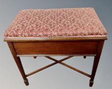 An Edwardian mahogany storage piano stool