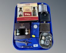 A tray of alcohol miniatures, hip flask, watches, drawing instruments,