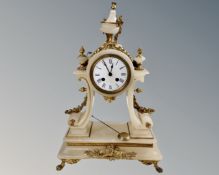 A 19th century French gilt metal and alabaster mantel clock