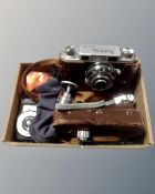 A vintage Konica camera in leather case, body numbered 28152, together with light meter, filters,