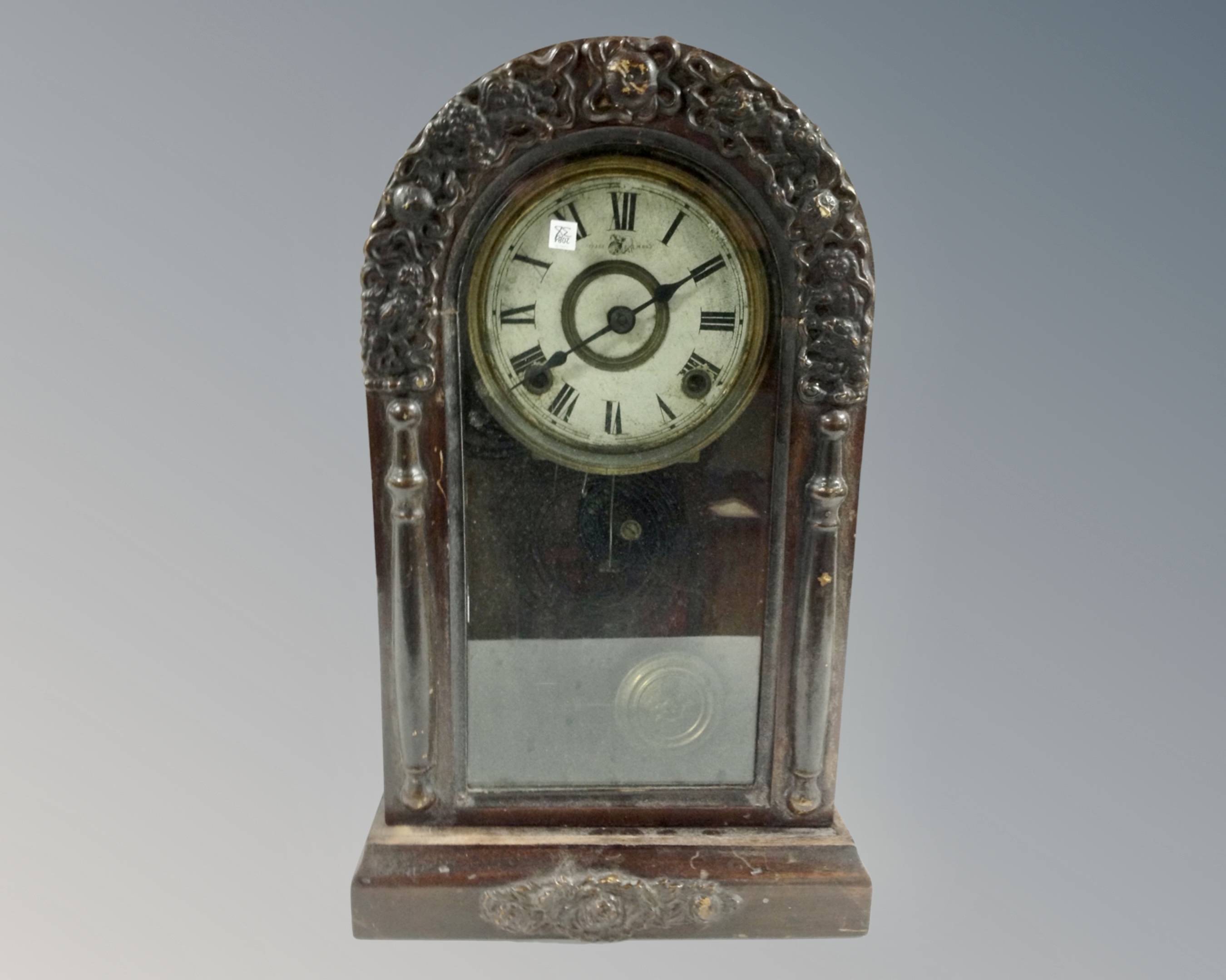 An early 20th century Japanese domed topped mantel clock