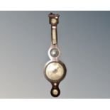 A George III barometer with silvered dial.