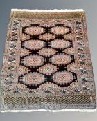 A Saryk Turkman carpet 170 cm x 130 cm, and a Balouch carpet, 214 cm x 118 cm.