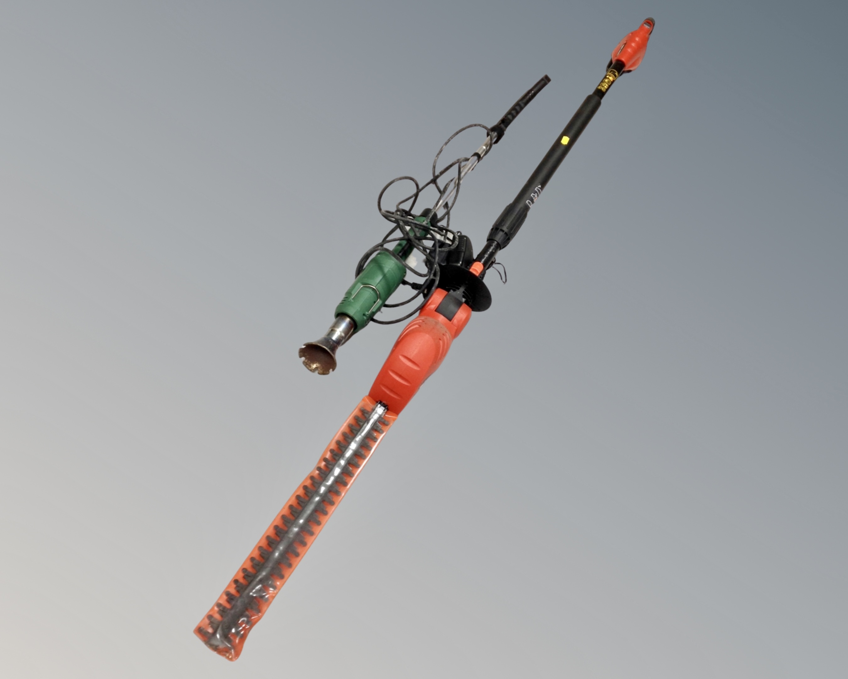 A Black and Decker GTC 800 electric pole saw with battery and charger together with brush burner