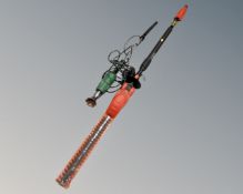 A Black and Decker GTC 800 electric pole saw with battery and charger together with brush burner