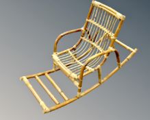 A 20th century bamboo and wicker child's rocking chair