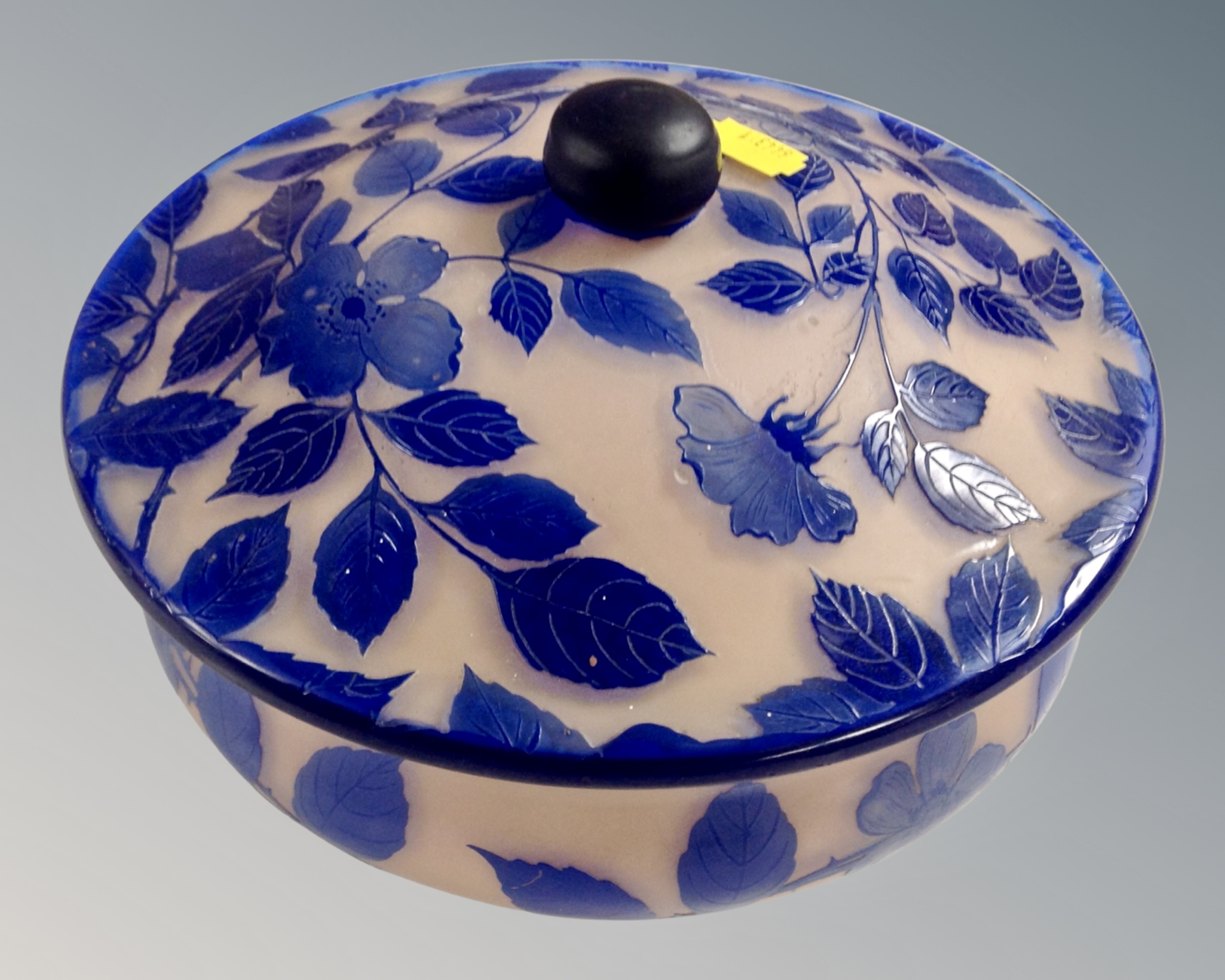 A decorative pink and blue glass lidded tureen on ball feet,