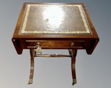 A Regency style sofa occasional table with tooled leather inset panel