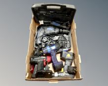A box of assorted power tools by Skilsaw, Ryobi,