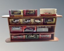 A wooden display stand containing die cast vehicles, Lledo,