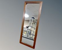 A 1970's teak framed mirror,