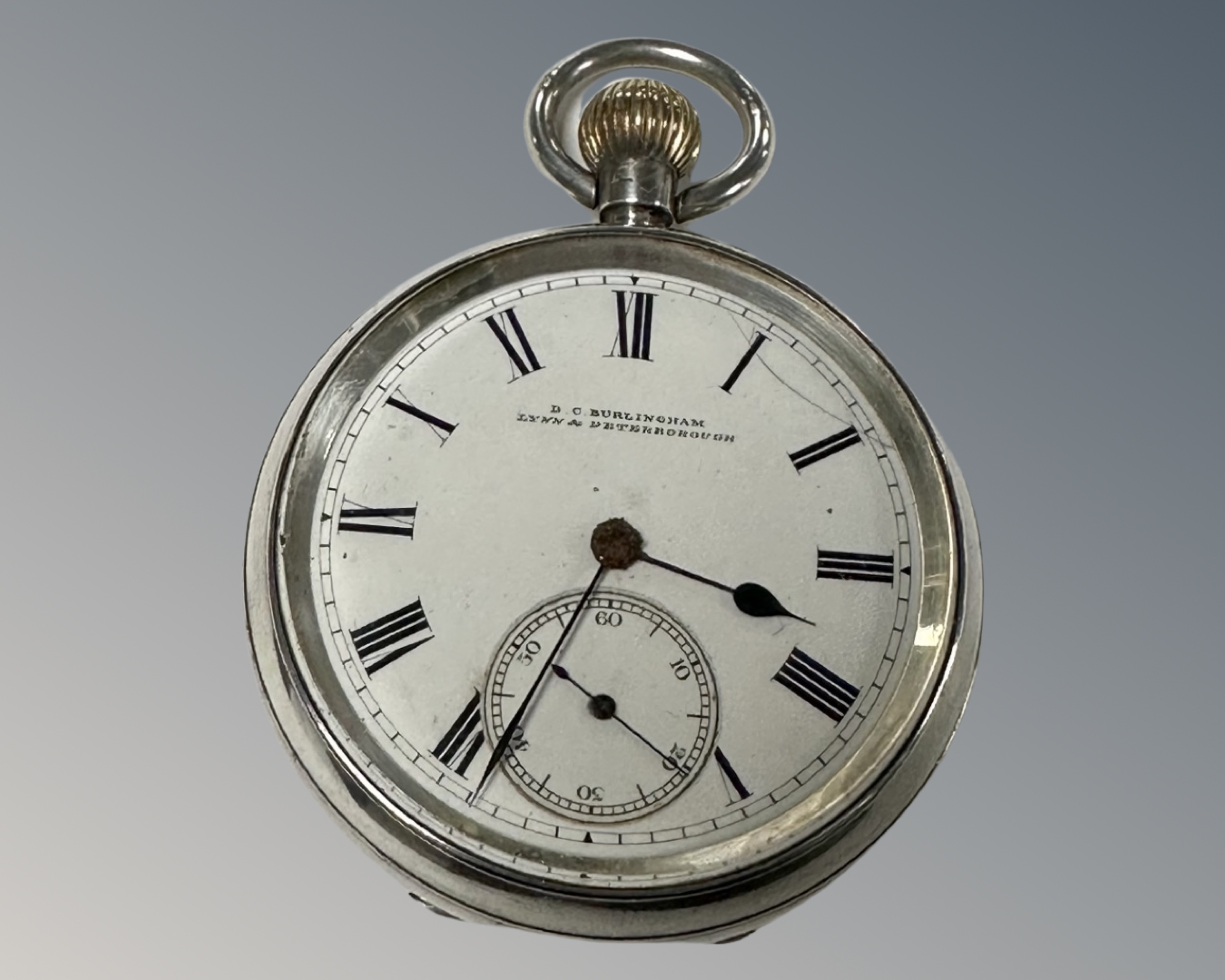 A silver cased pocket watch, Birmingham hallmarks, retailed by D. C.