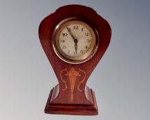 An Edwardian mahogany Arts & Crafts mantel clock