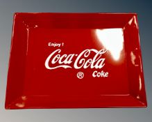 A reproduction Coca Cola tin tray