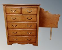 A six drawer chest together with similar glass topped three drawer hall table and headboard in teak