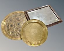 Two Eastern brass trays and a 19th century wall mirror