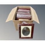 One crate containing twenty three dark wood photo frames, 20 cm x 25 cm,