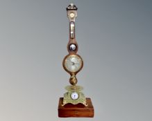 A gilt metal and alabaster eight day wall clock surmounted by a figure,