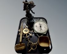 A tray of assorted metal wares : antique bronzed cherub figure, brass ladle, bells,
