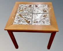 A 20th century teak tiled topped occasional table