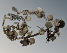 A collection of silver and white metal chains and charms