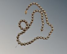 A cultured pearl necklace with 14ct yellow gold clasp, length 45 cm.