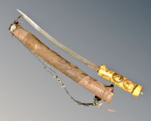 A curved bladed sword with a later wooden American theme handle in a home made sheath