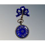 An antique fob watch mounted on bar with enamelled decoration