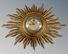 A Smith electric sun burst gilt wall clock