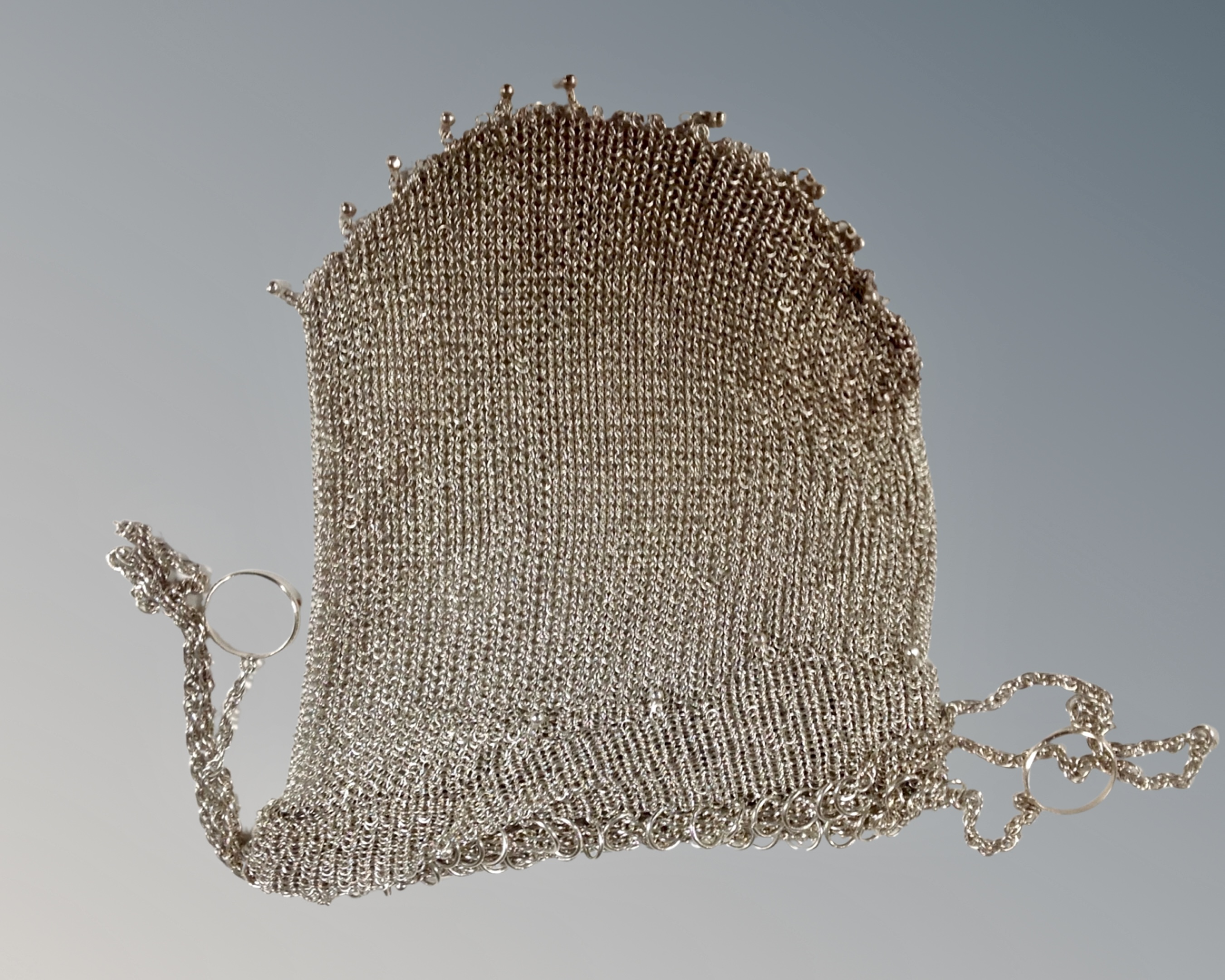 A silver chain purse