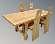 A contemporary bleached oak refectory dining table and four chairs,