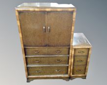 A 1930s oak linen cabinet and a matching three drawer pedestal