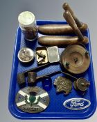 A tray of Indian head belt buckle, vintage fishing reel, pipes, Scottish Albion claymore car badge,