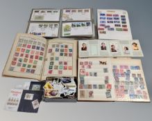 A tray of three stamp albums of stamps, album of first day covers,
