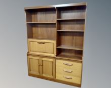 A 20th century teak veneered wall unit