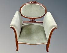 A 19th century carved beech framed armchair in green dralon